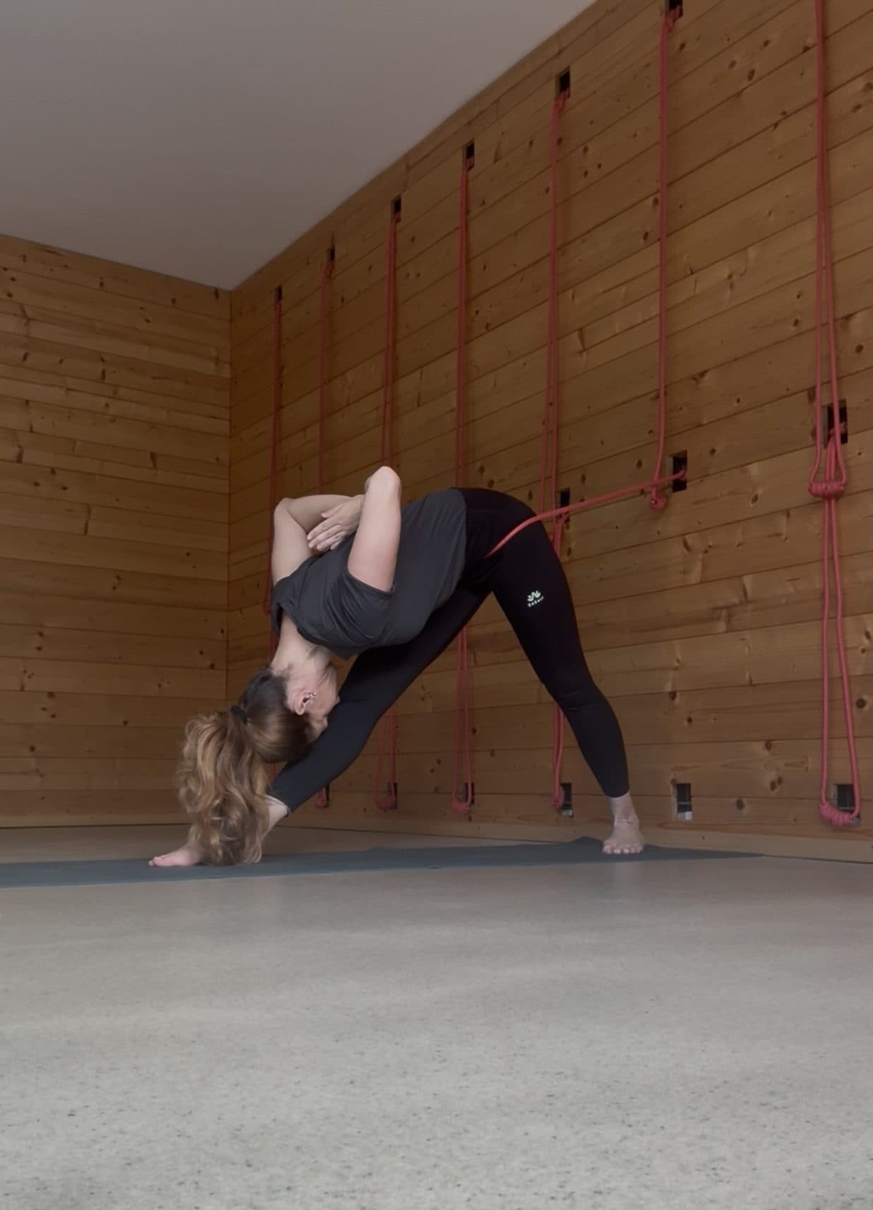 Savelia performing Parivrttanasana at Studio Namaste